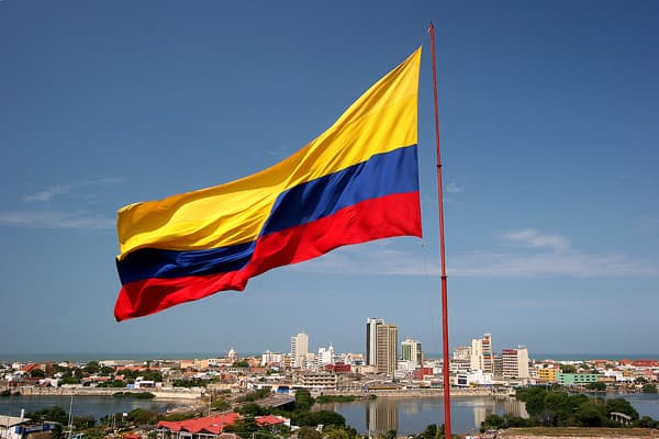 Colombian flag above the National Capitol at Bolívar Square in Bogotá